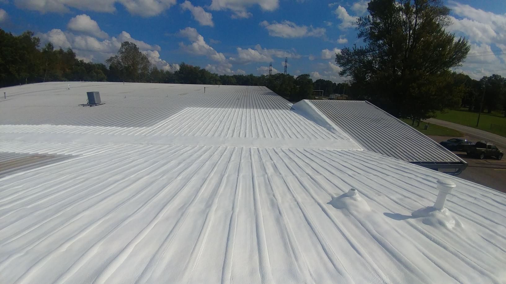 A white roof with a blue sky in the background.