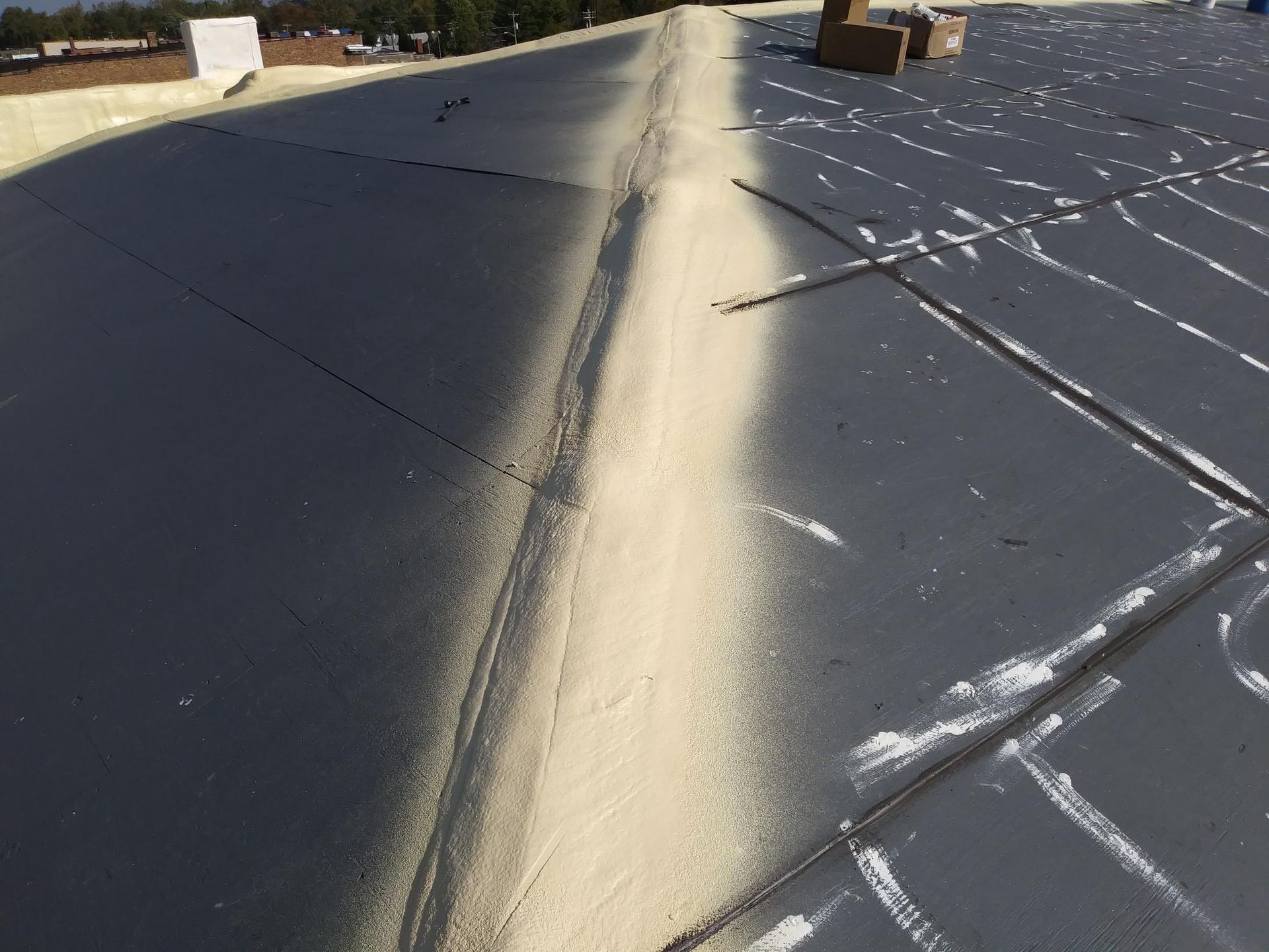 A roof with a lot of spray paint on it.