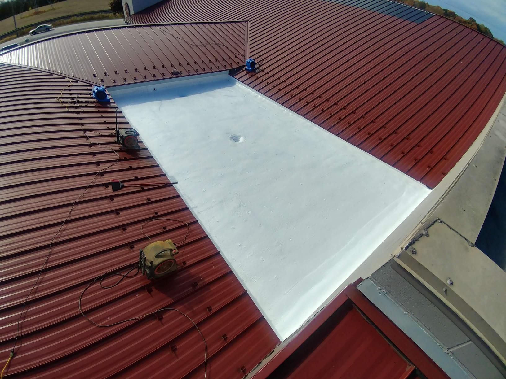 A red roof with a white triangle on it