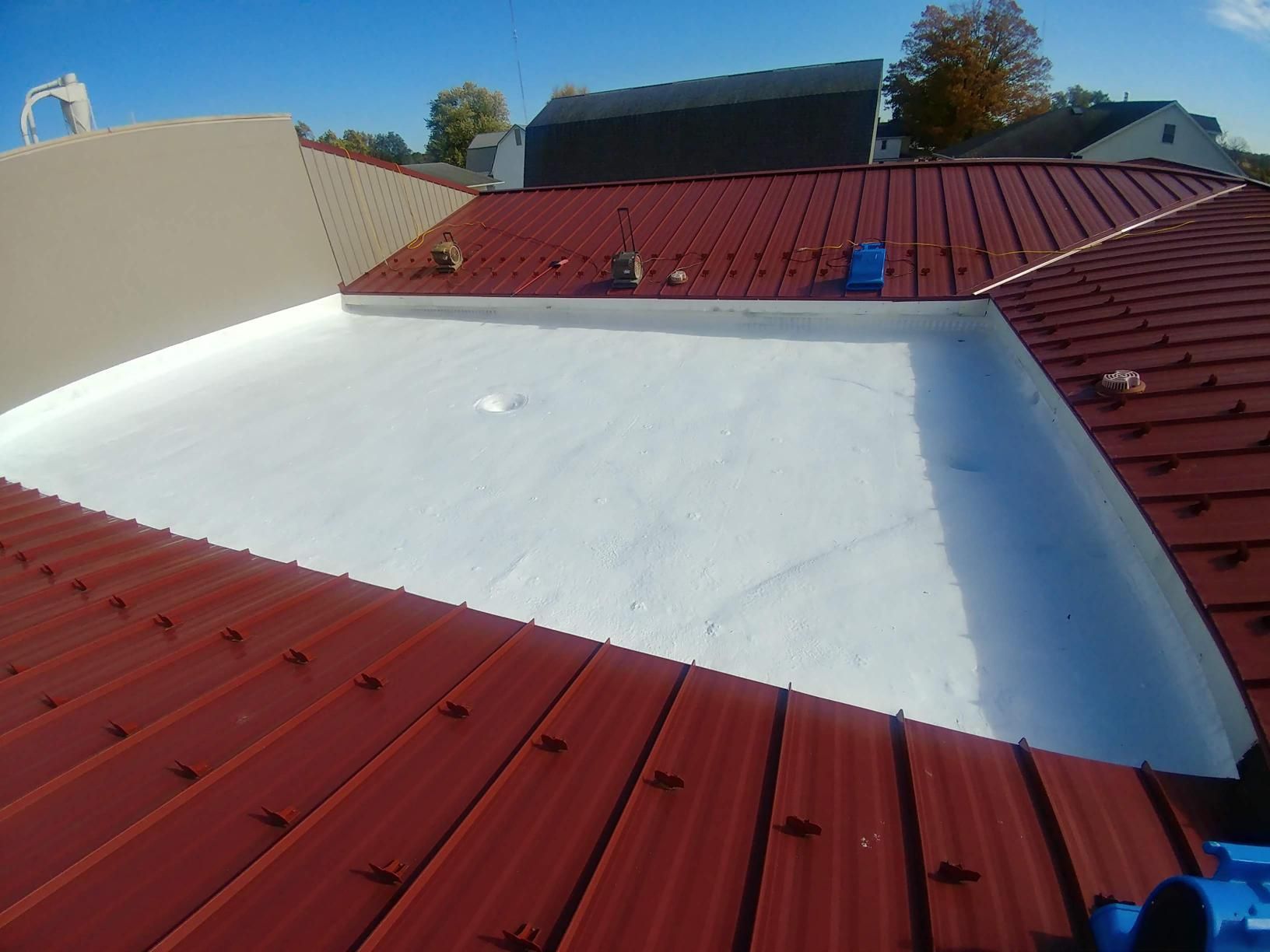 A red roof with a white roof in the middle