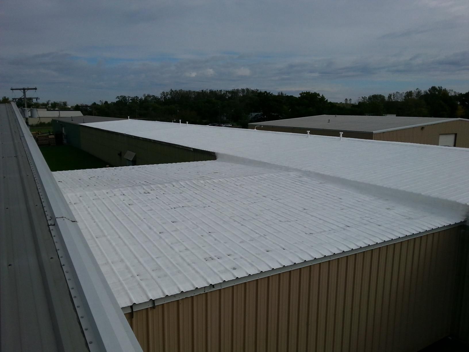 The roof of a building has been painted white