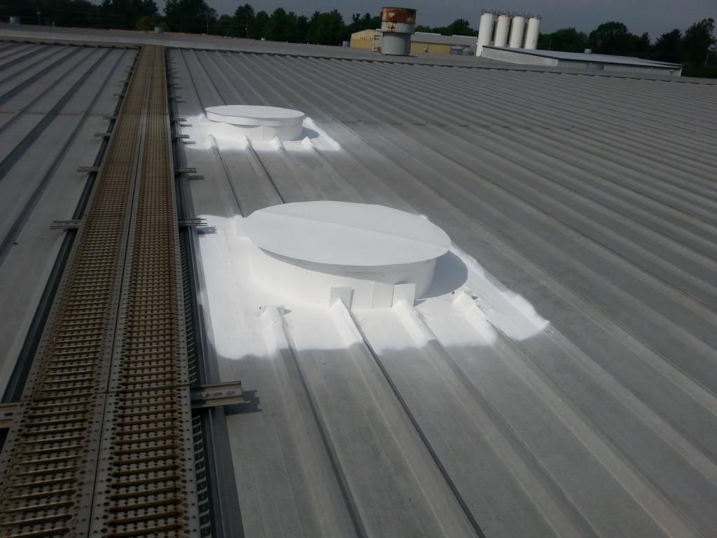 The roof of a building has been painted white