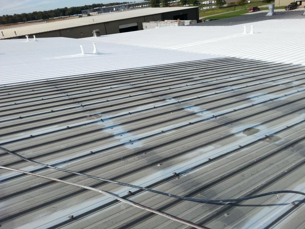 The roof of a building has been painted white