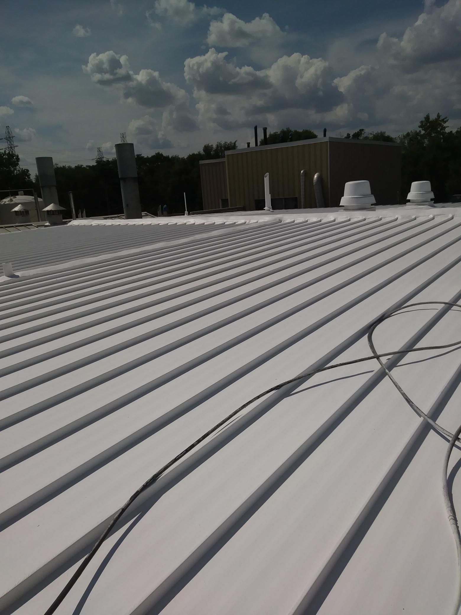 A white roof with a blue sky in the background