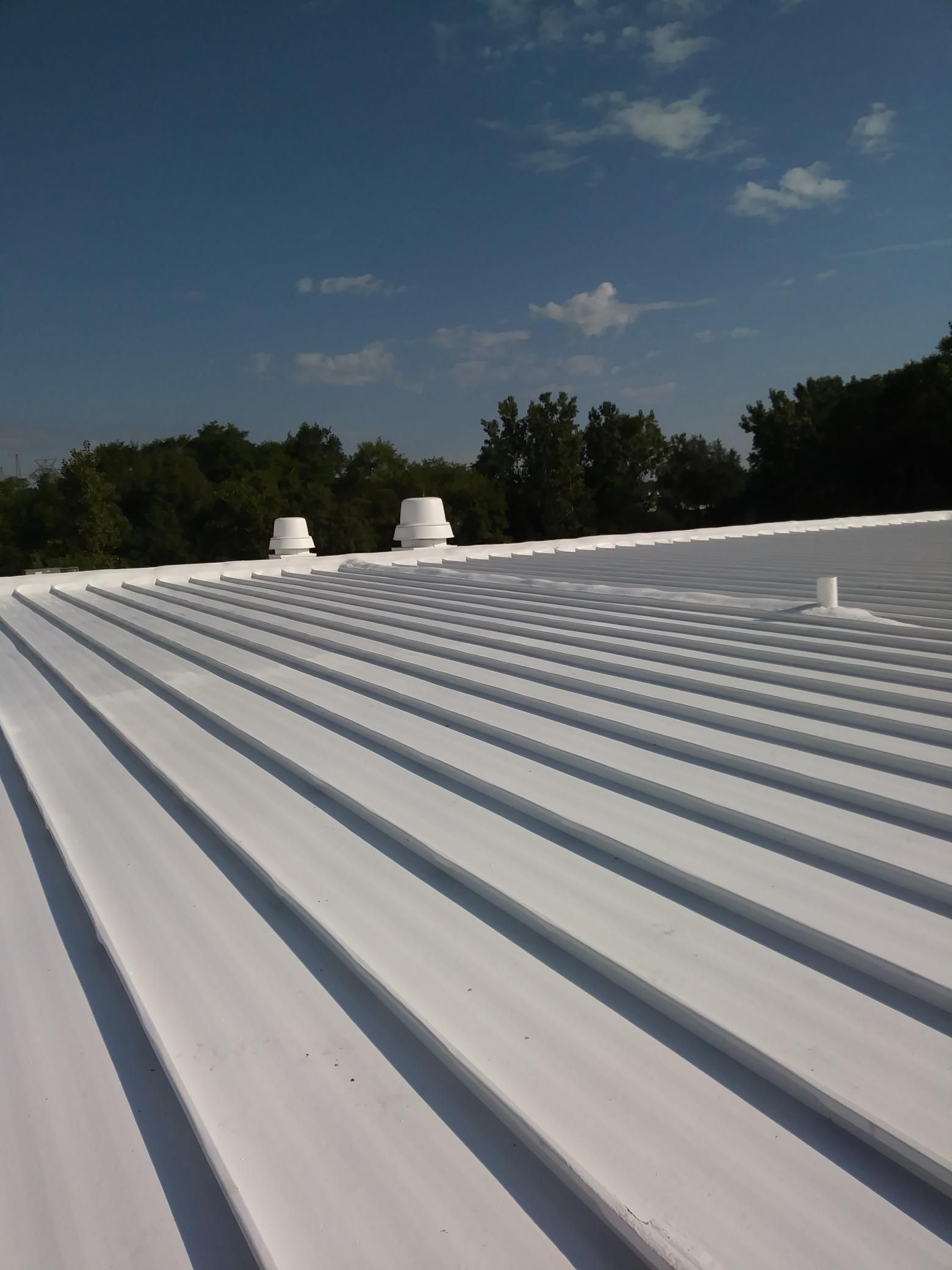 A white roof with a blue sky in the background