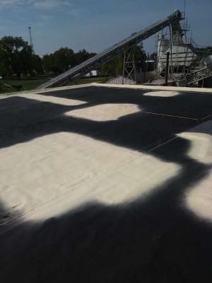 A black and white checkered floor with a conveyor belt in the background.