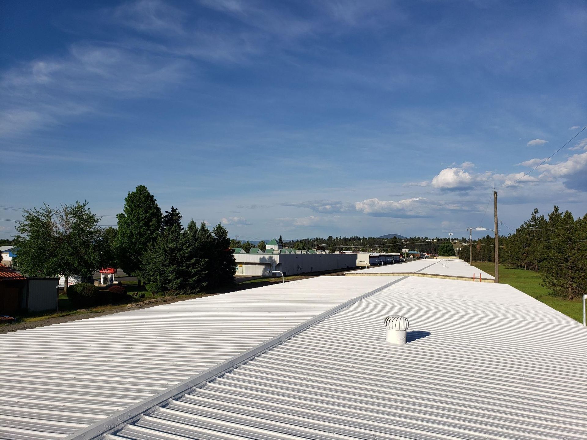 A white roof with a blue sky in the background