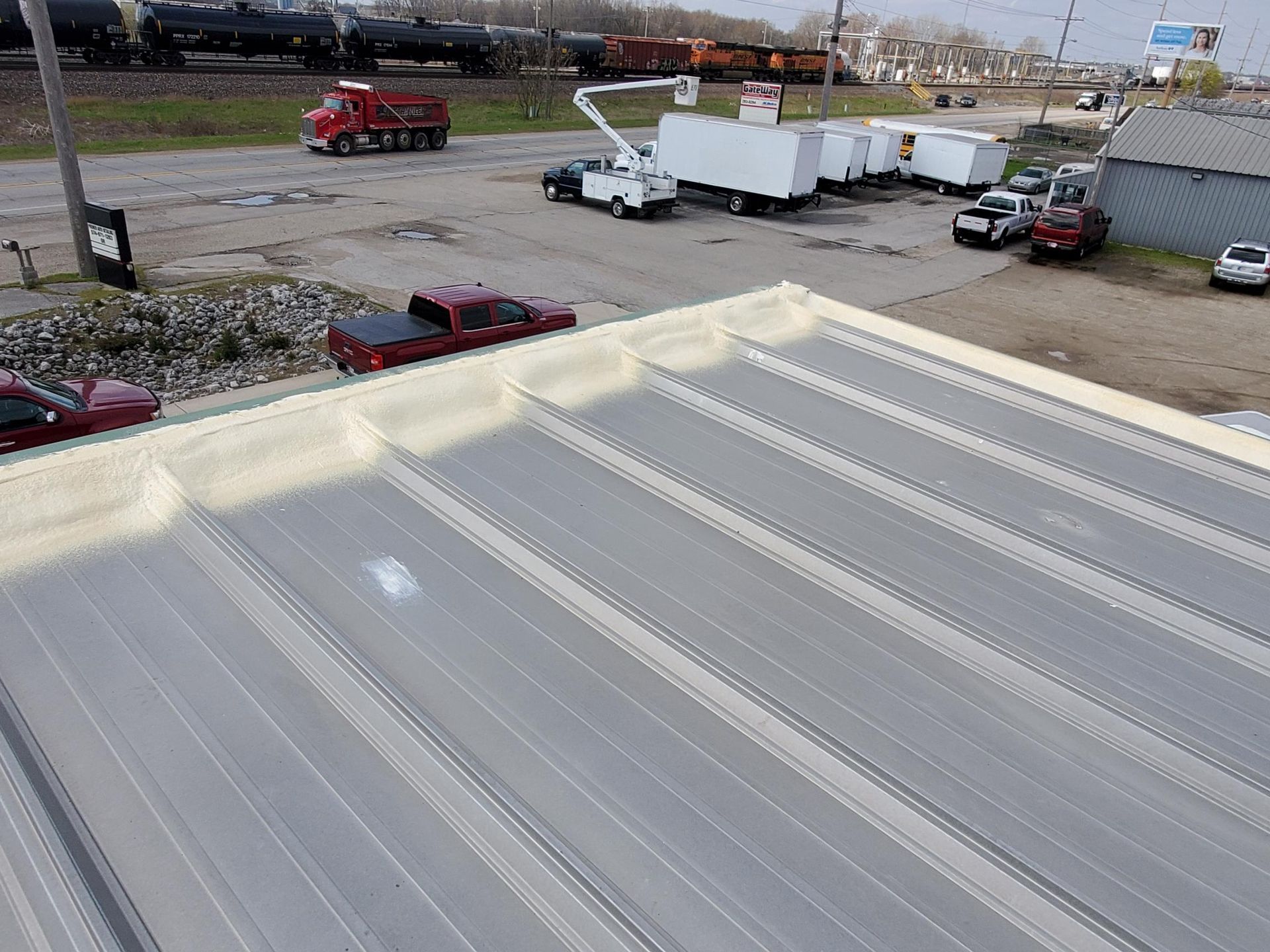 An aerial view of a roof with trucks parked on it.