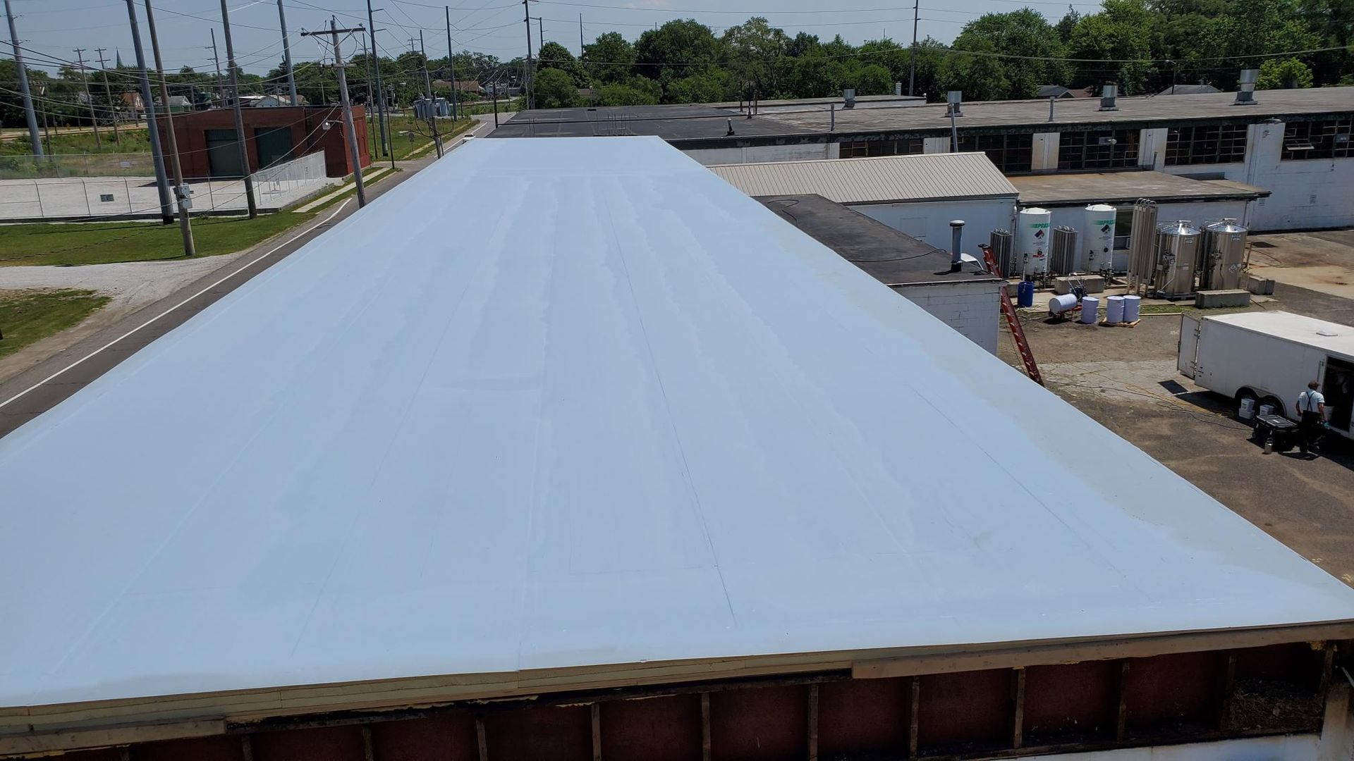 A large white roof is being built on top of a building.