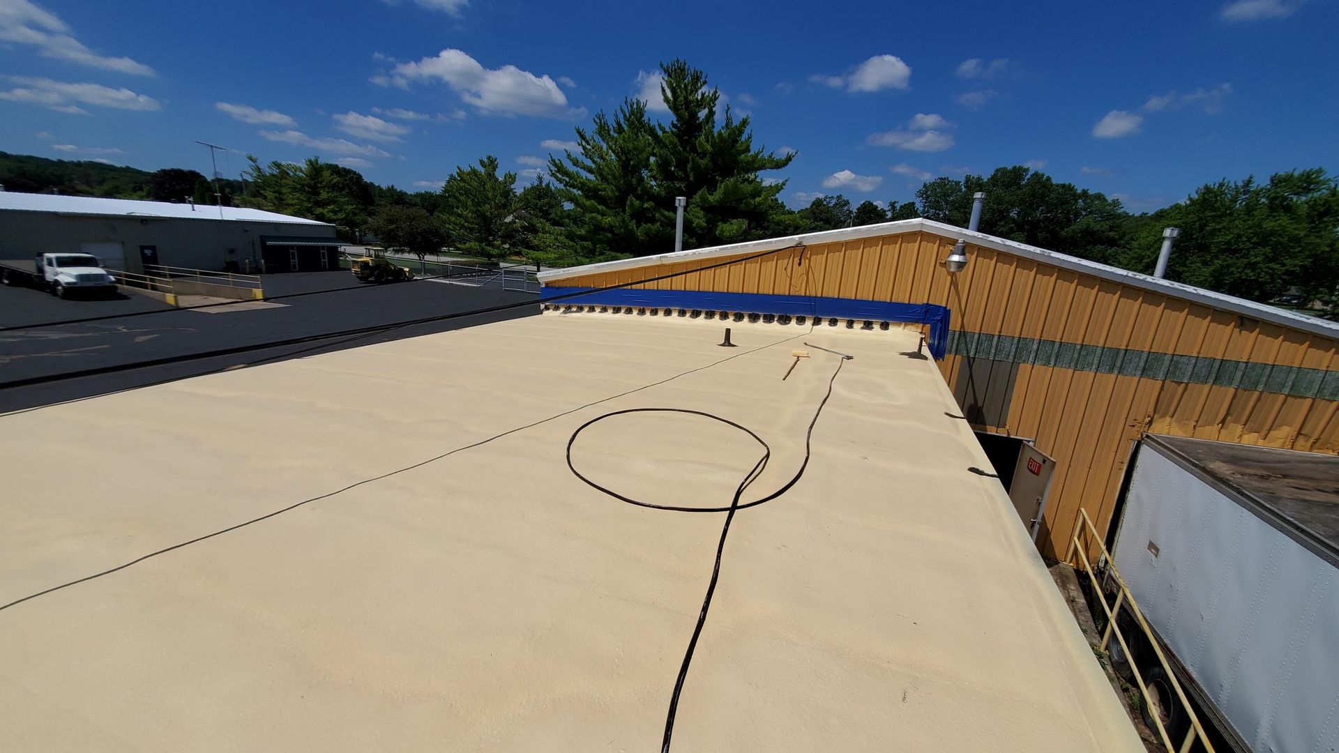 A roof with a circle on it is being installed on a building.