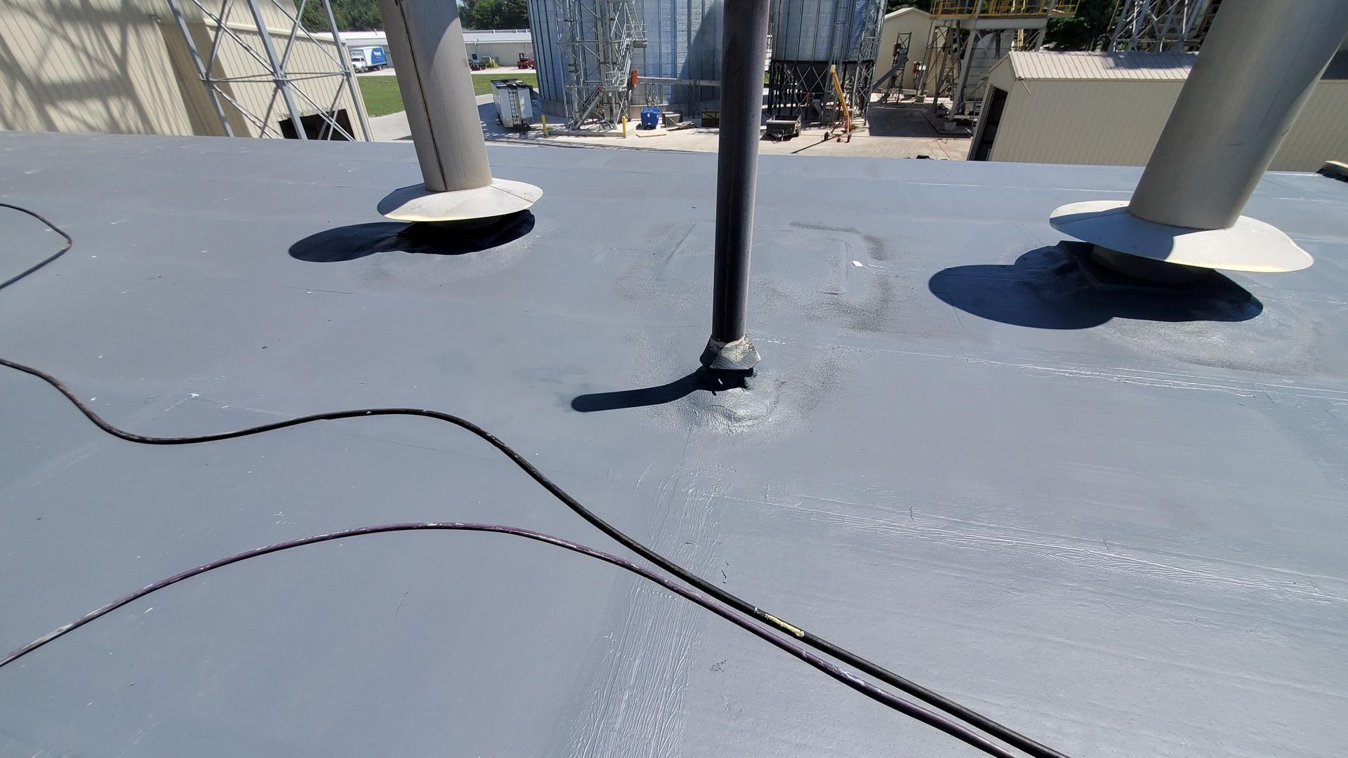 A close up of a roof with a hose on it.