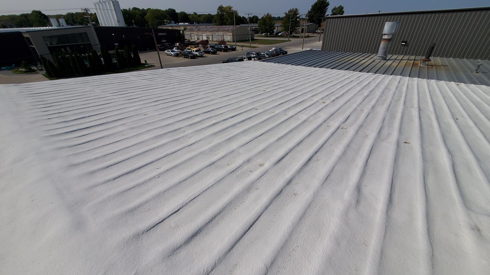 A close up of a white roof with a lot of lines on it.
