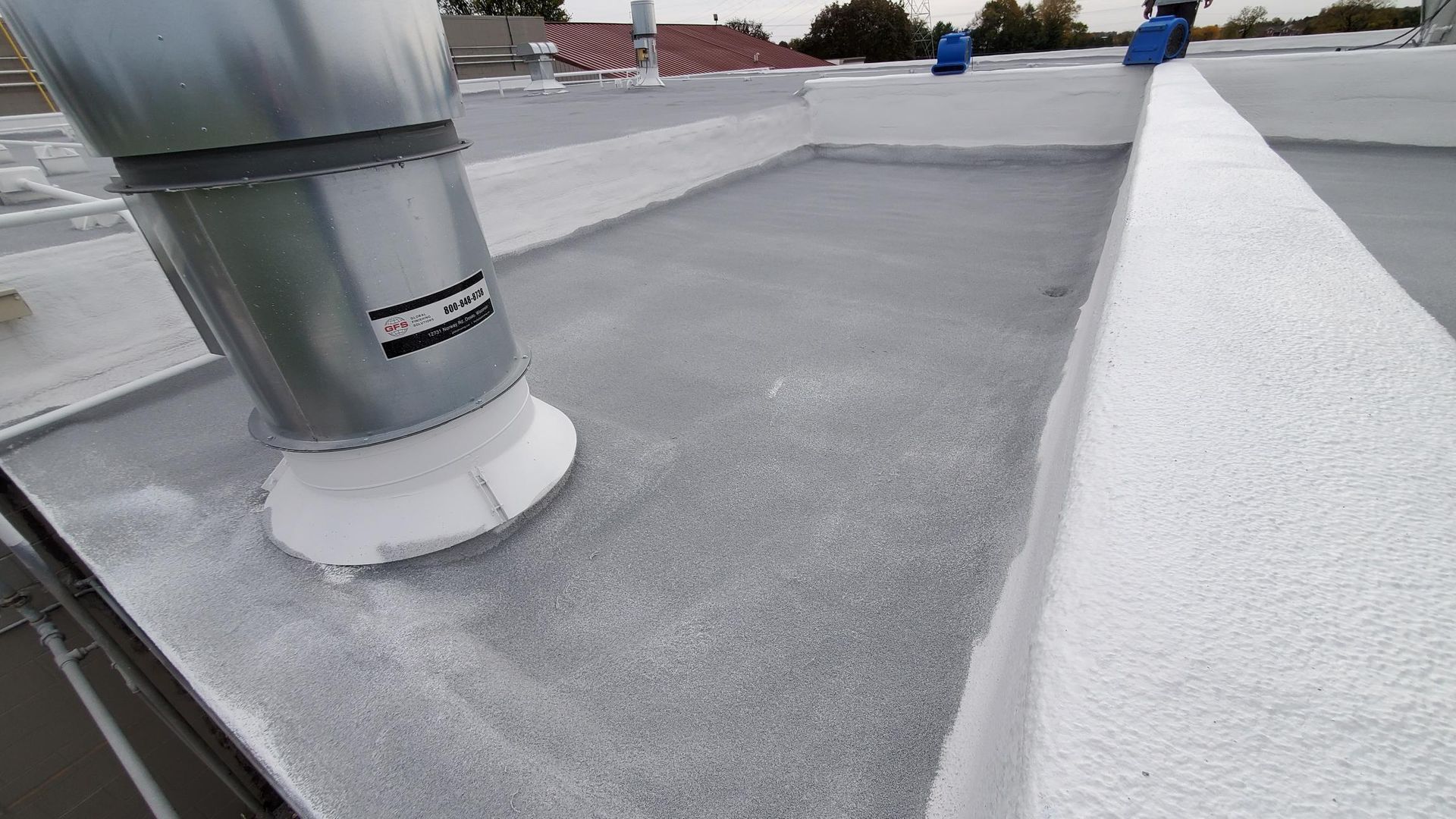 A close up of a roof with a ventilation pipe on it.