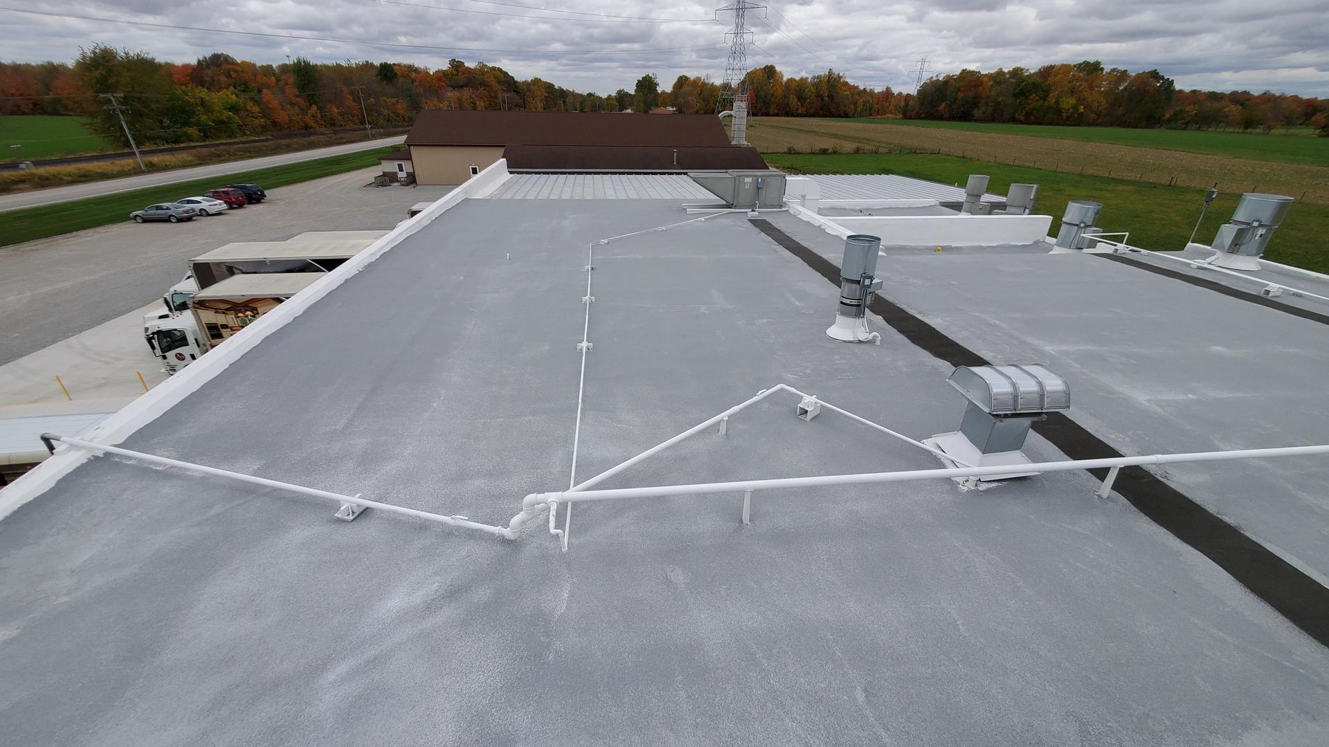 An aerial view of a roof with a lot of wires on it.