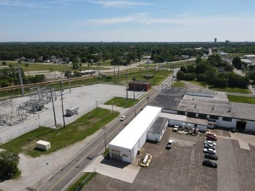 An aerial view of a building and a parking lot