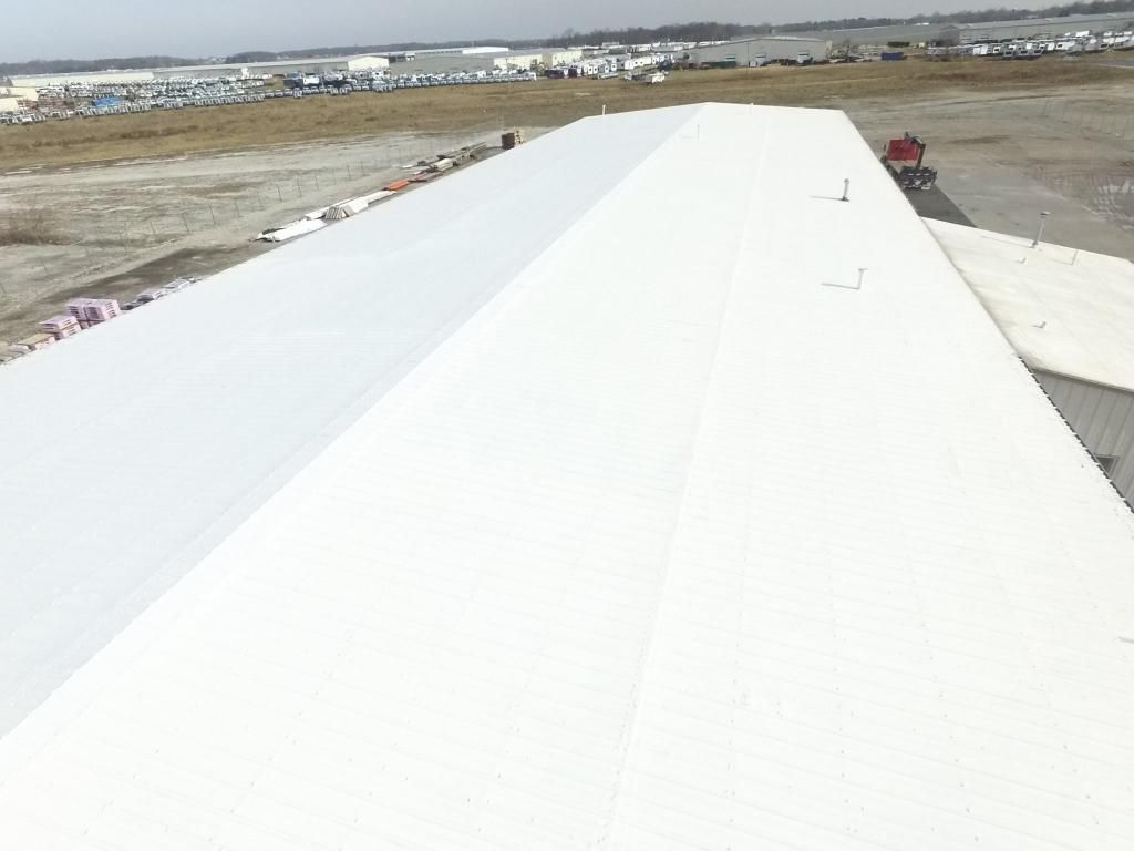 A close up of an airplane wing on a runway