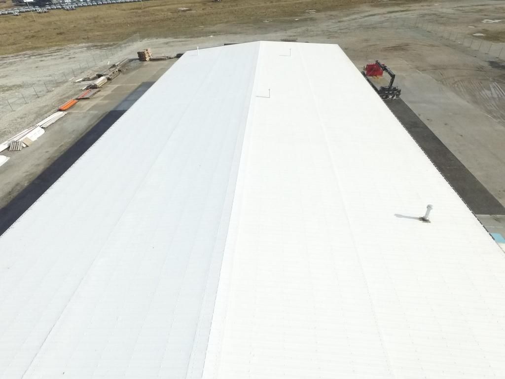 An aerial view of a large white roof