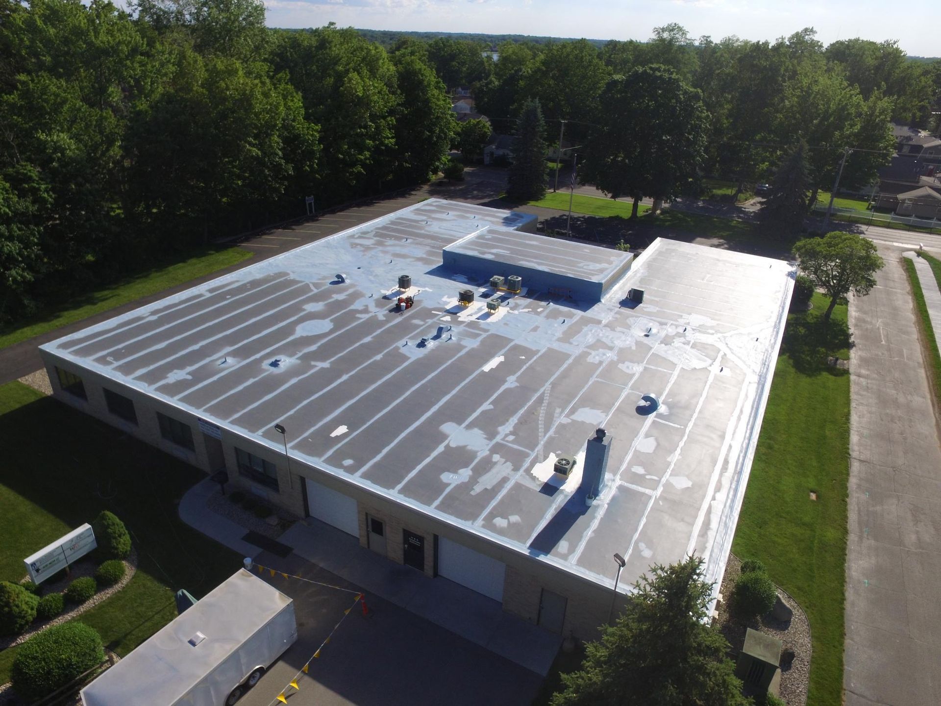 An aerial view of a large building with a flat roof