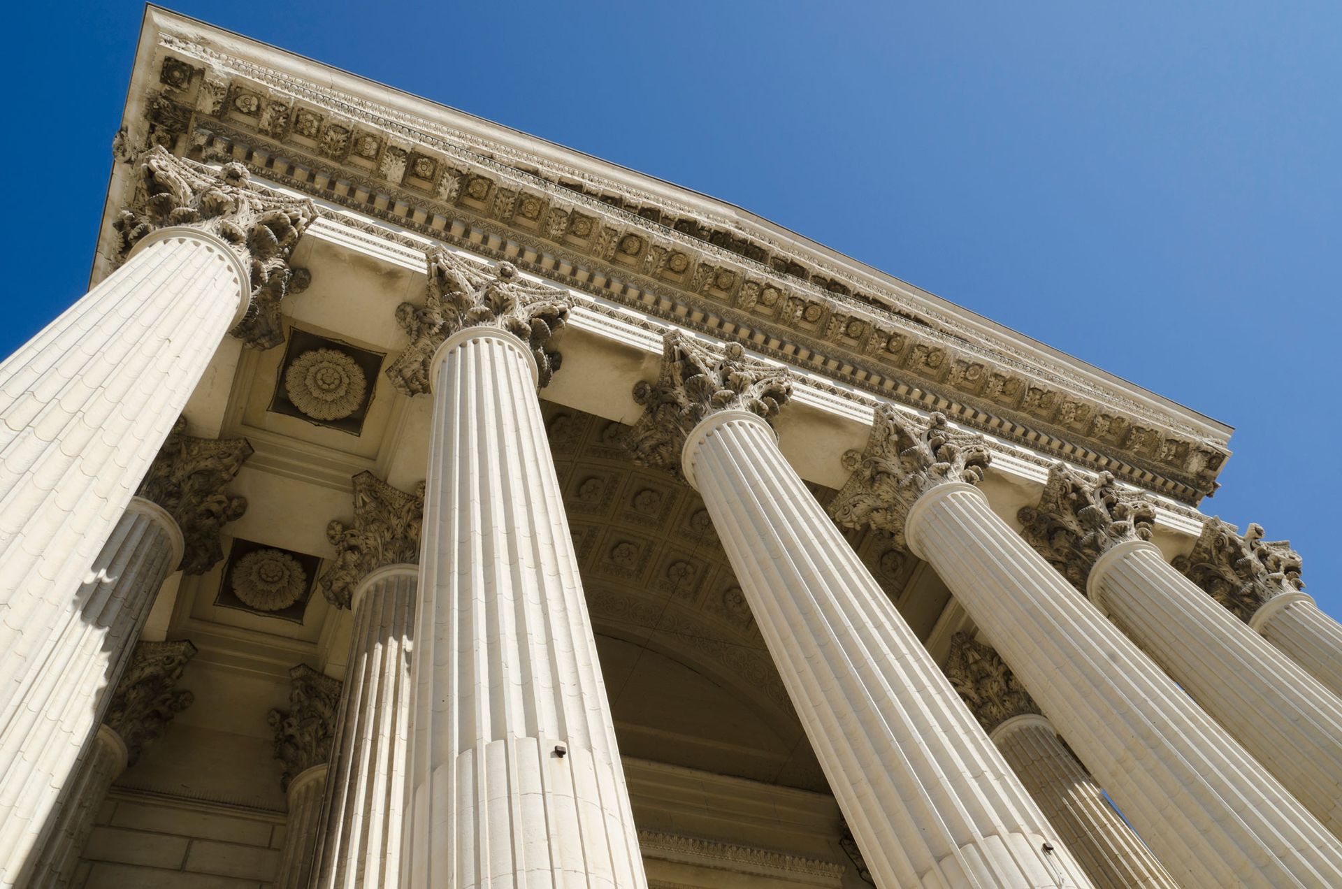 Looking up at the columns of the supreme court building