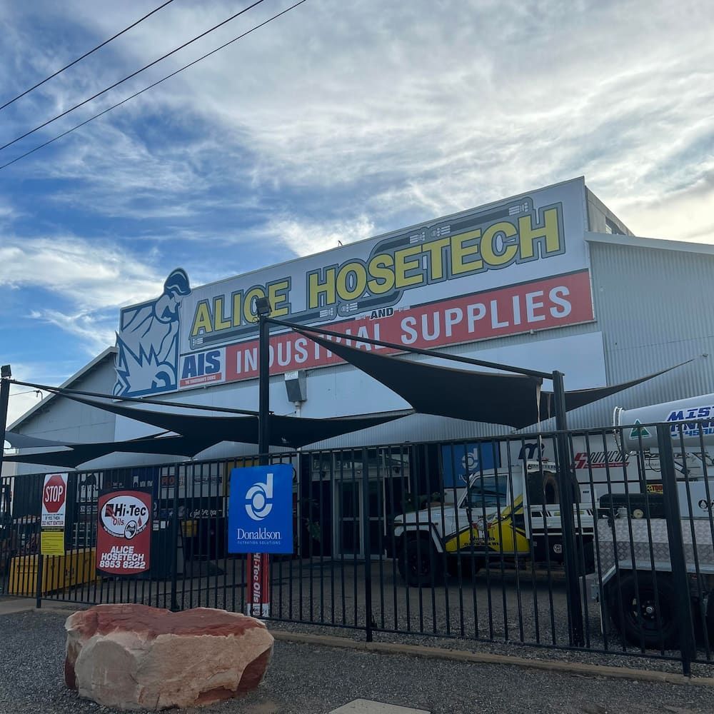 A Building With A Sign That Says Alice Hosetech Industrial Supplies — AHT Towing in Ciccone, NT