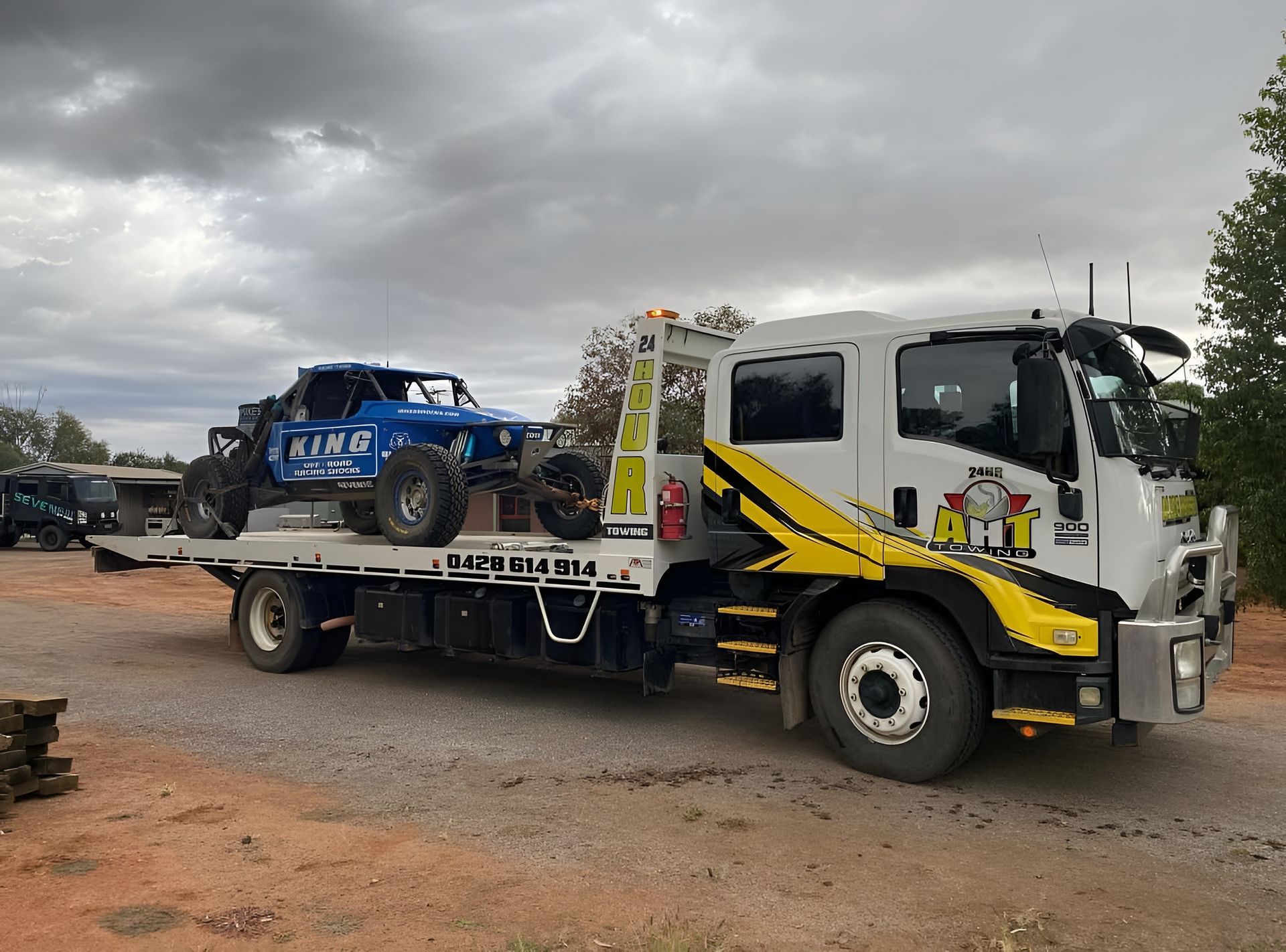 Tow Truck Towing An Off-Road Vehicle