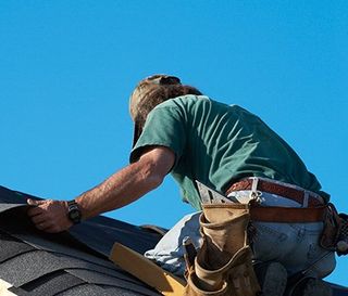 Roof Inspections — Worker Replacing the Roof in Port Richey, FL