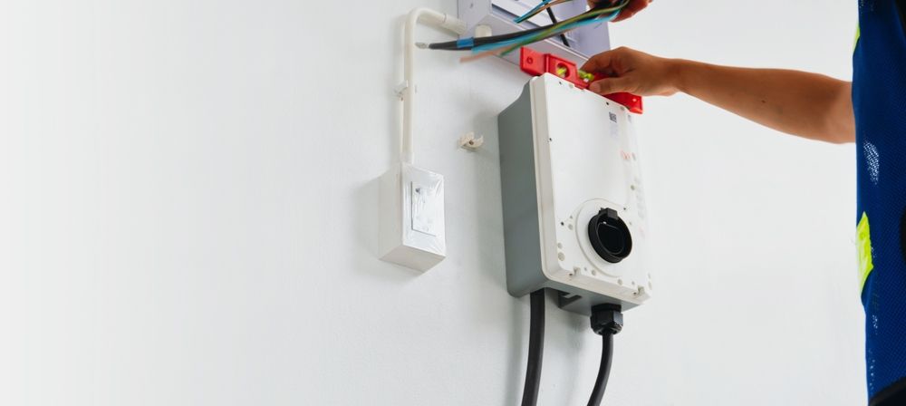 Electrician Working on Electrical Components — Mazlin Electrical Services Pty Ltd in Kirwan, QLD