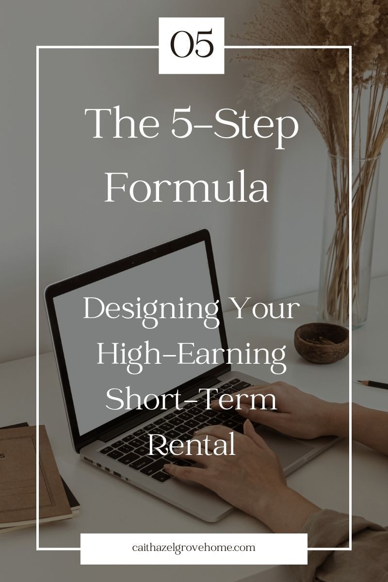 A person is typing on a laptop computer on a desk.