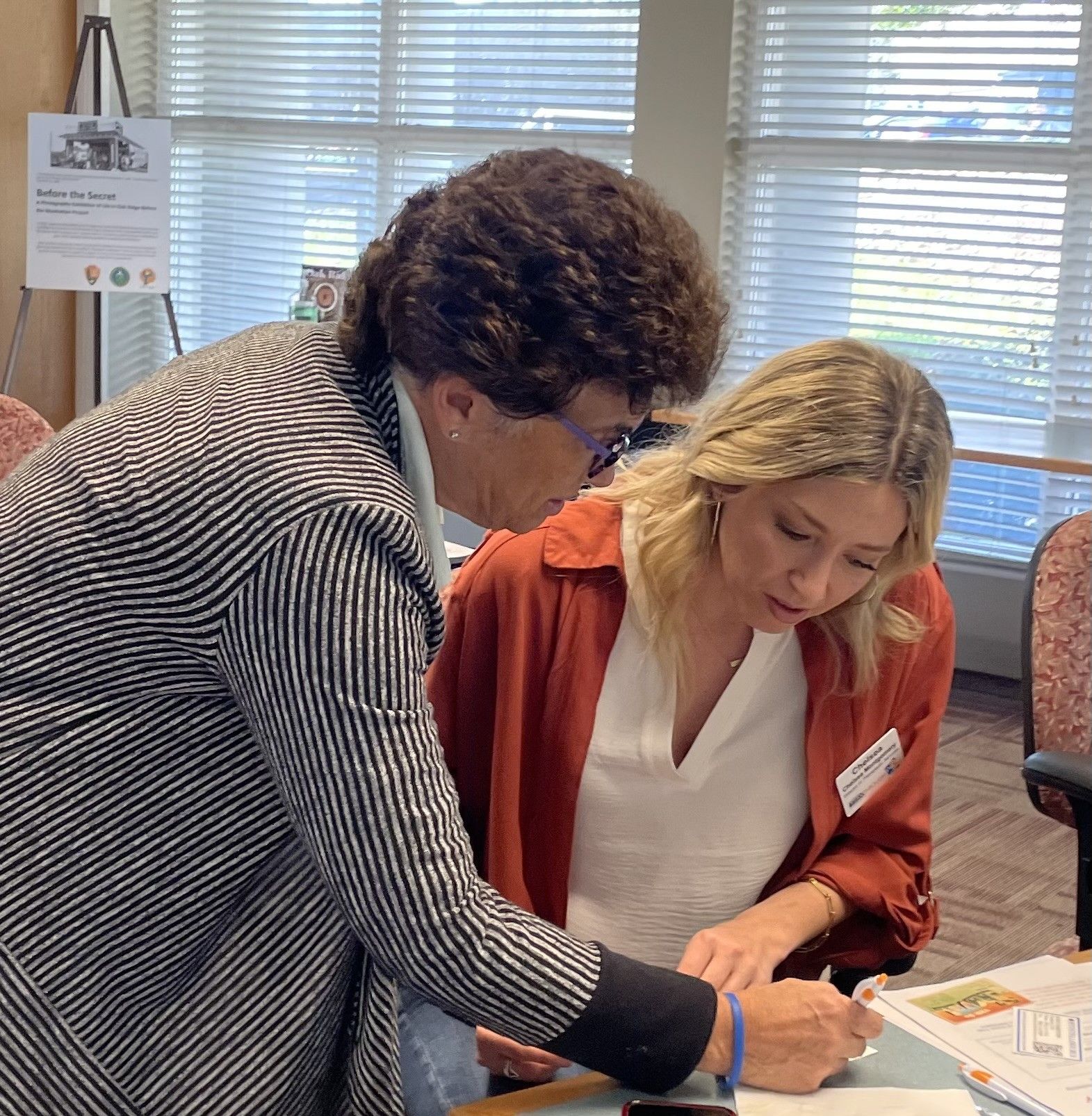 a group of people raising their hands in front of a projector screen that says getting started