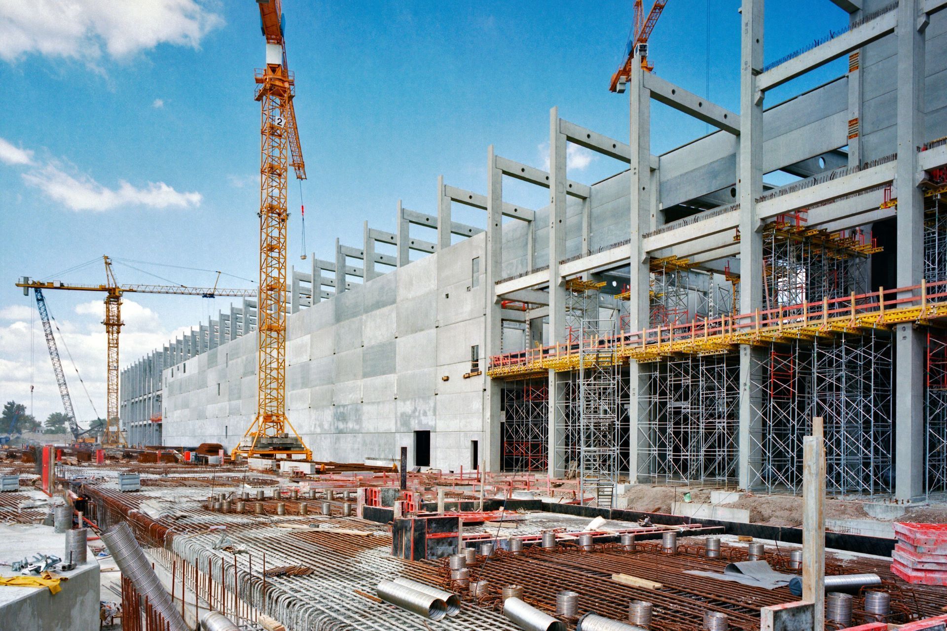 A large building under construction with cranes and scaffolding in Oak Ridge, TN.