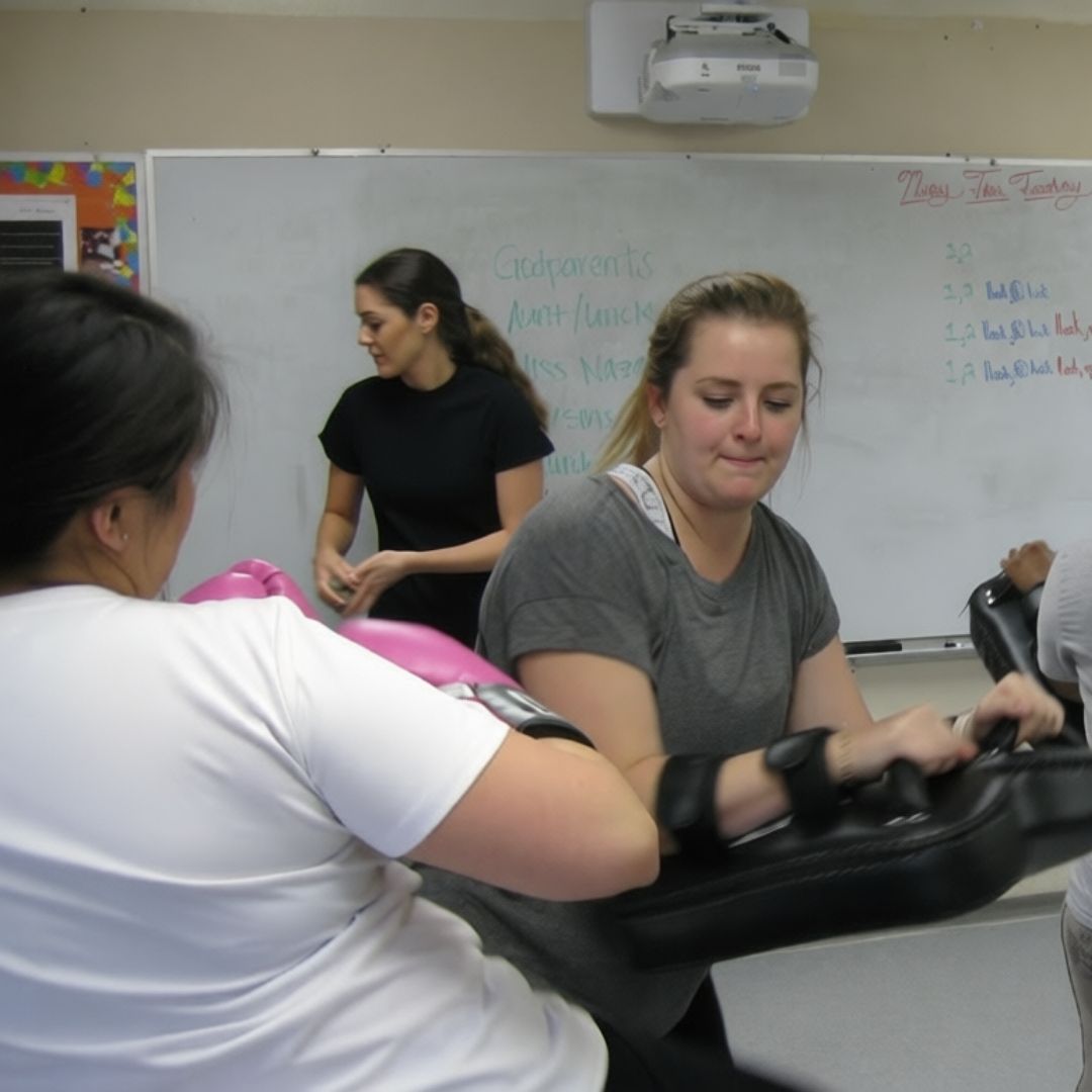 Four men in athletic gear, posing for a photo in a gym.