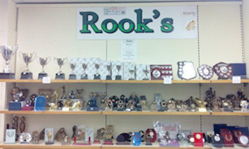 Shelves of trophies in our shop