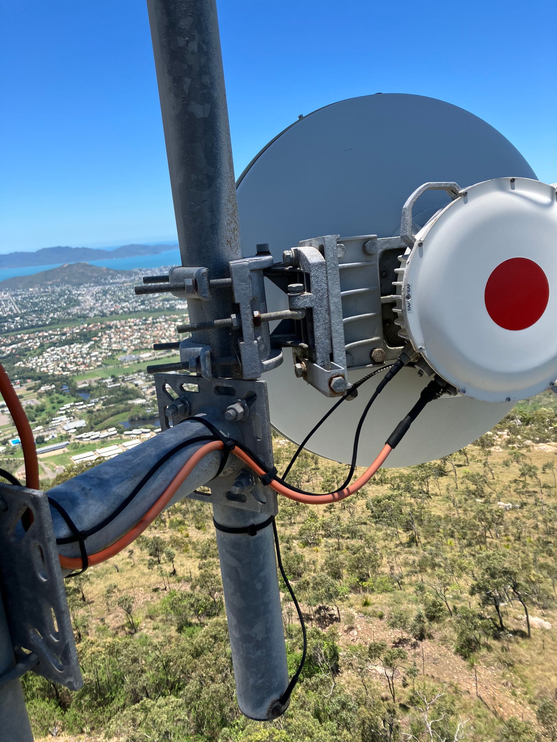 A satellite dish with a red dot on it