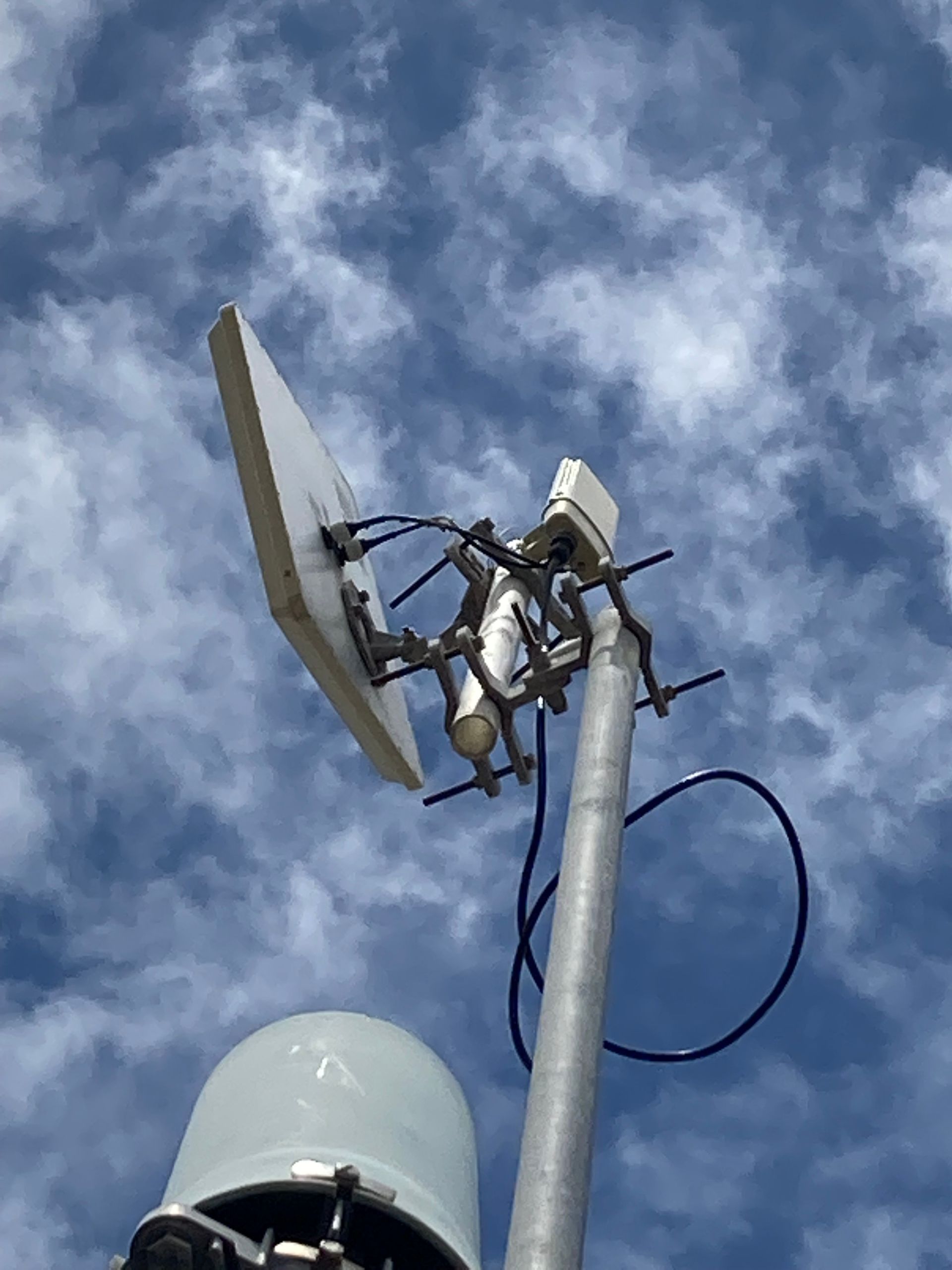 Man is Climbing Up a Very Tall Metal Tower — Sape Industries in Garbutt, QLD