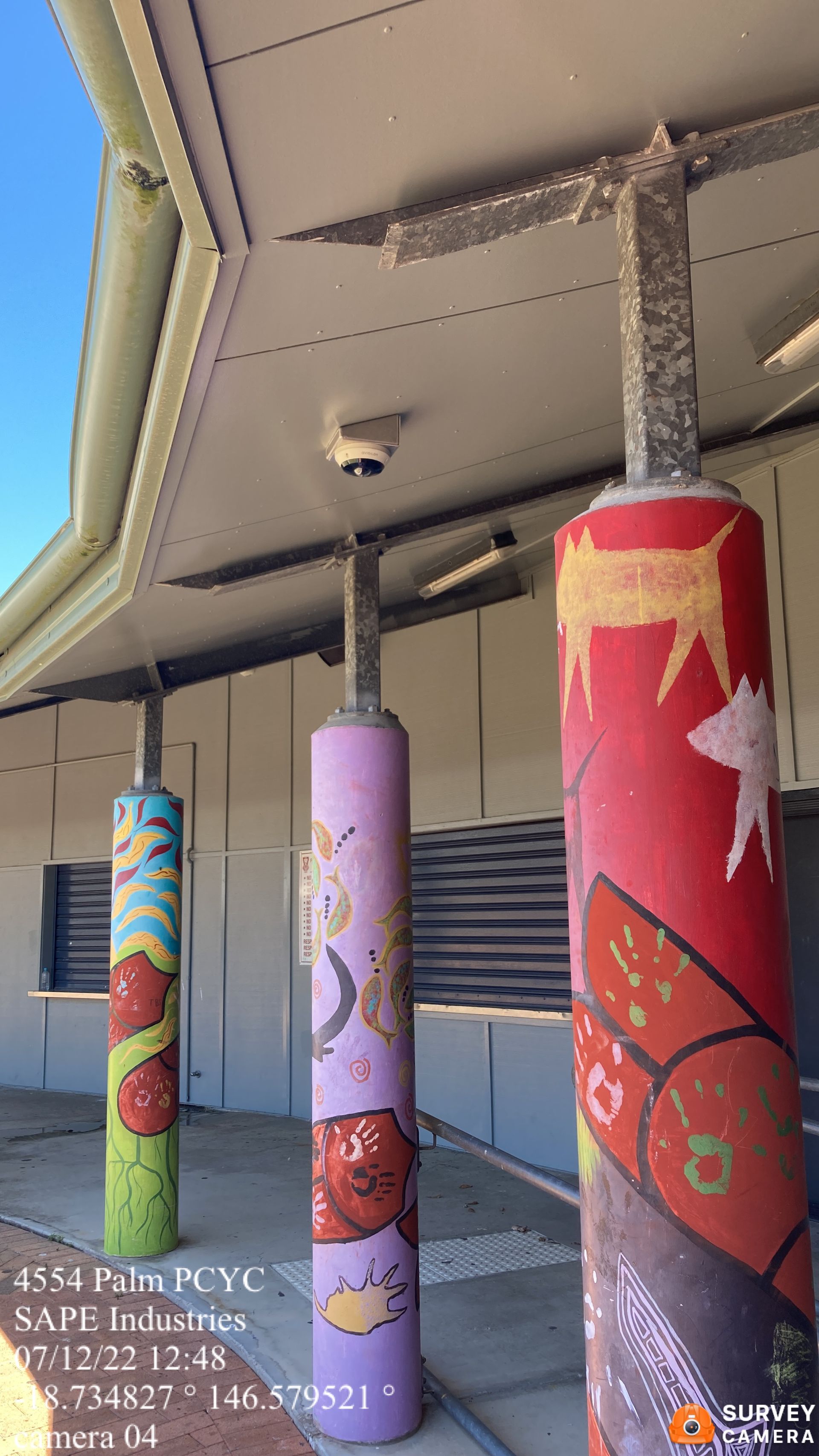 A building with a lot of pillars painted on it