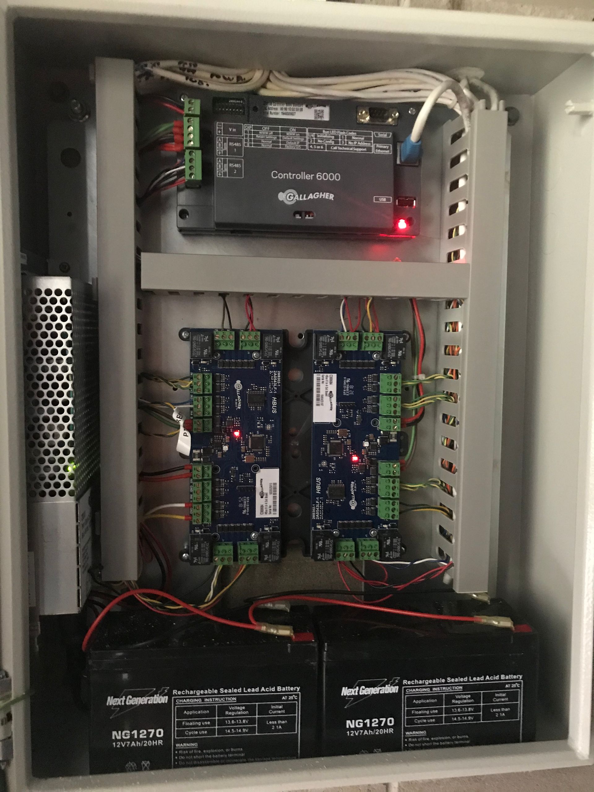 A white box filled with lots of wires and electronics.