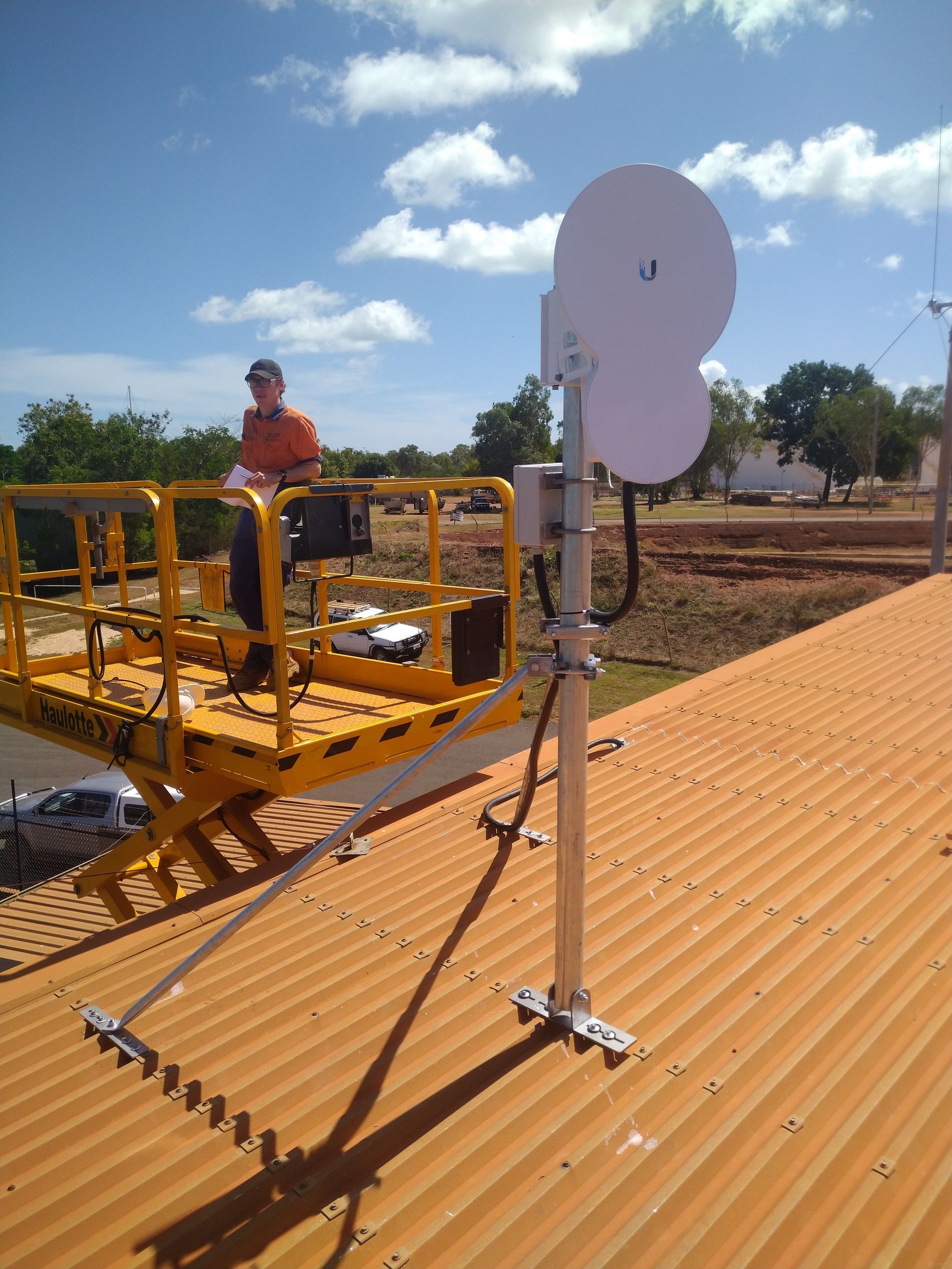 Man is Standing Next to a Pipe in a Trench — Sape Industries in Burdekin, QLD