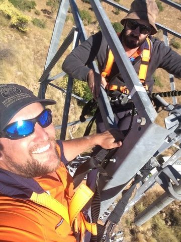 Two Men Are Standing on Top of a Metal Structure — Sape Industries in Hinchinbrook, QLD