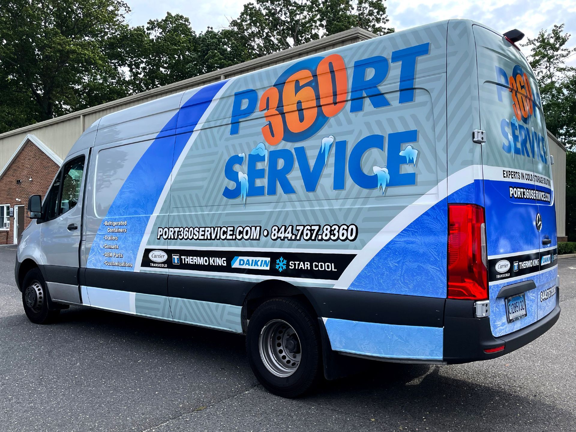 A van that says p 360 rt service is parked in front of a building.