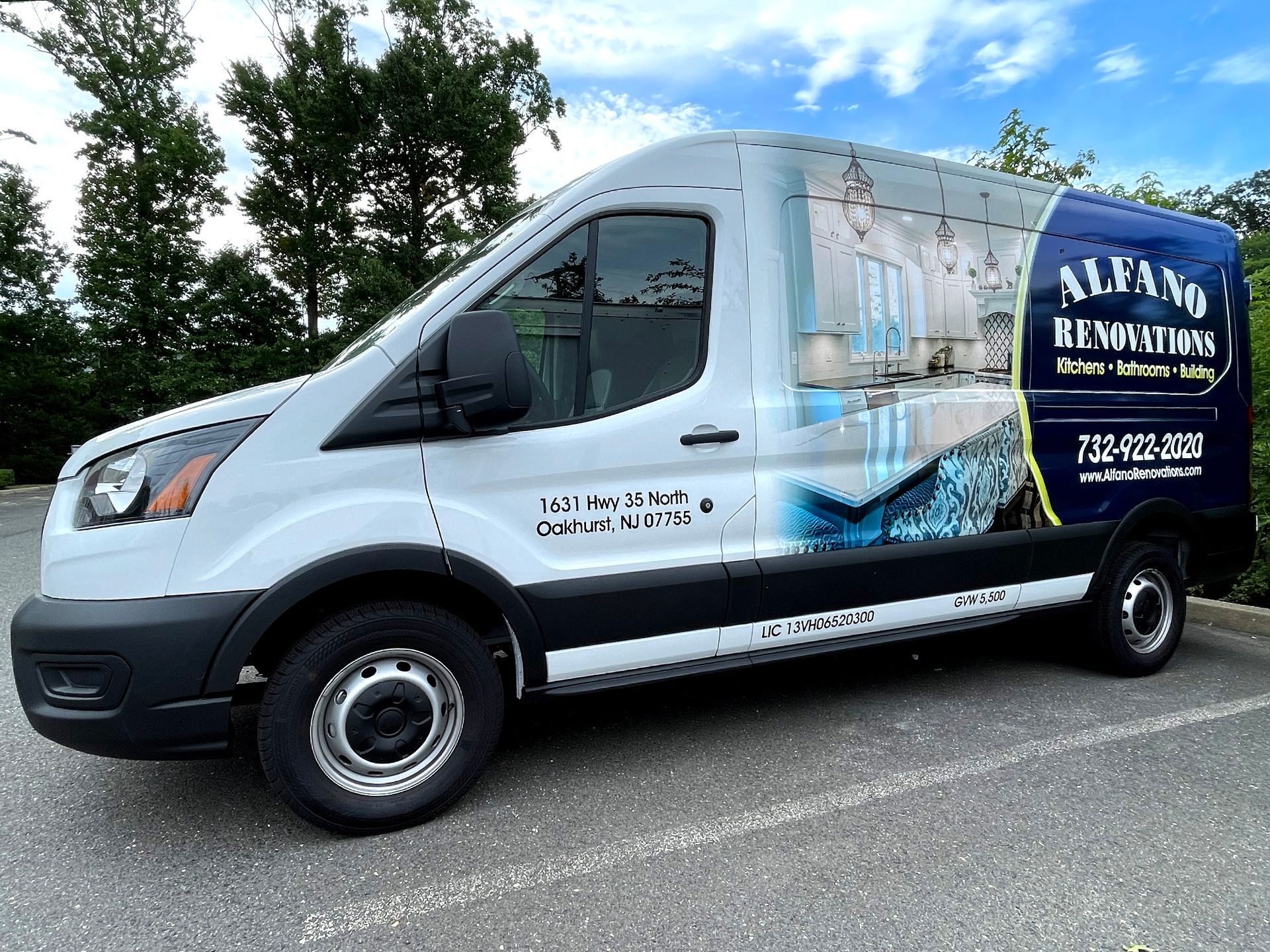 A white van is parked in a parking lot.