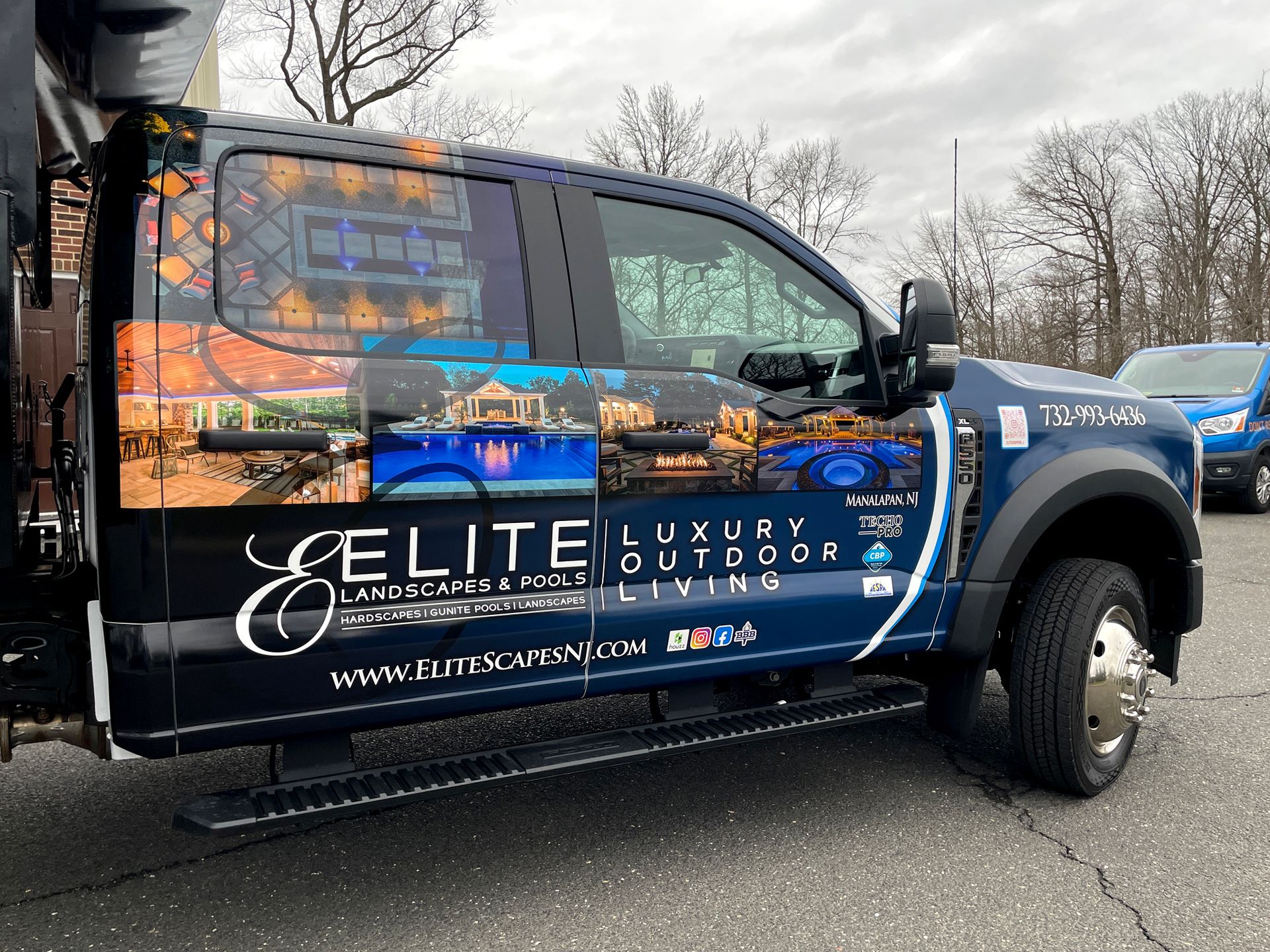 A black van with the word elite on the side of it