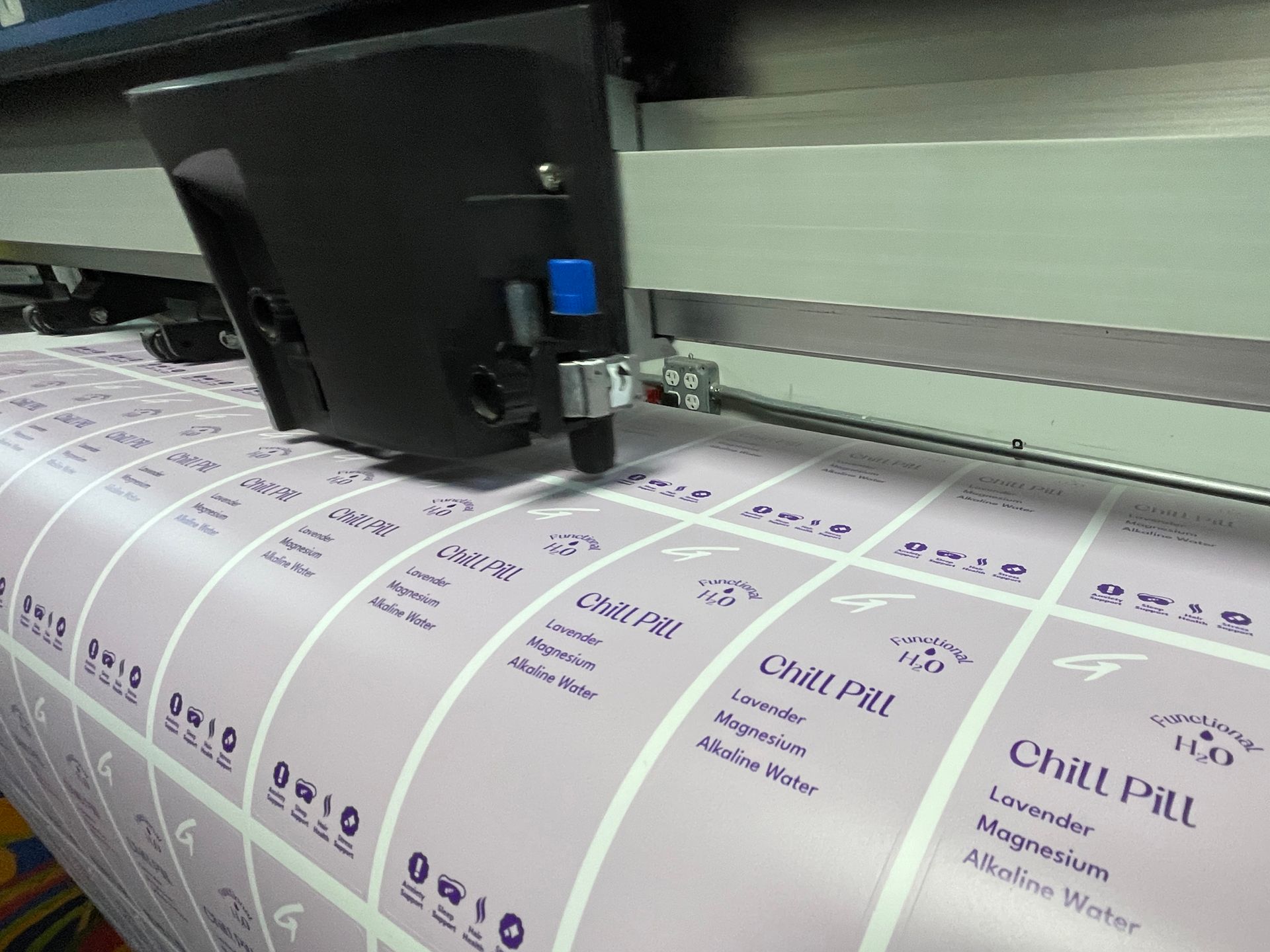 A machine is printing a lot of labels that say chit pat