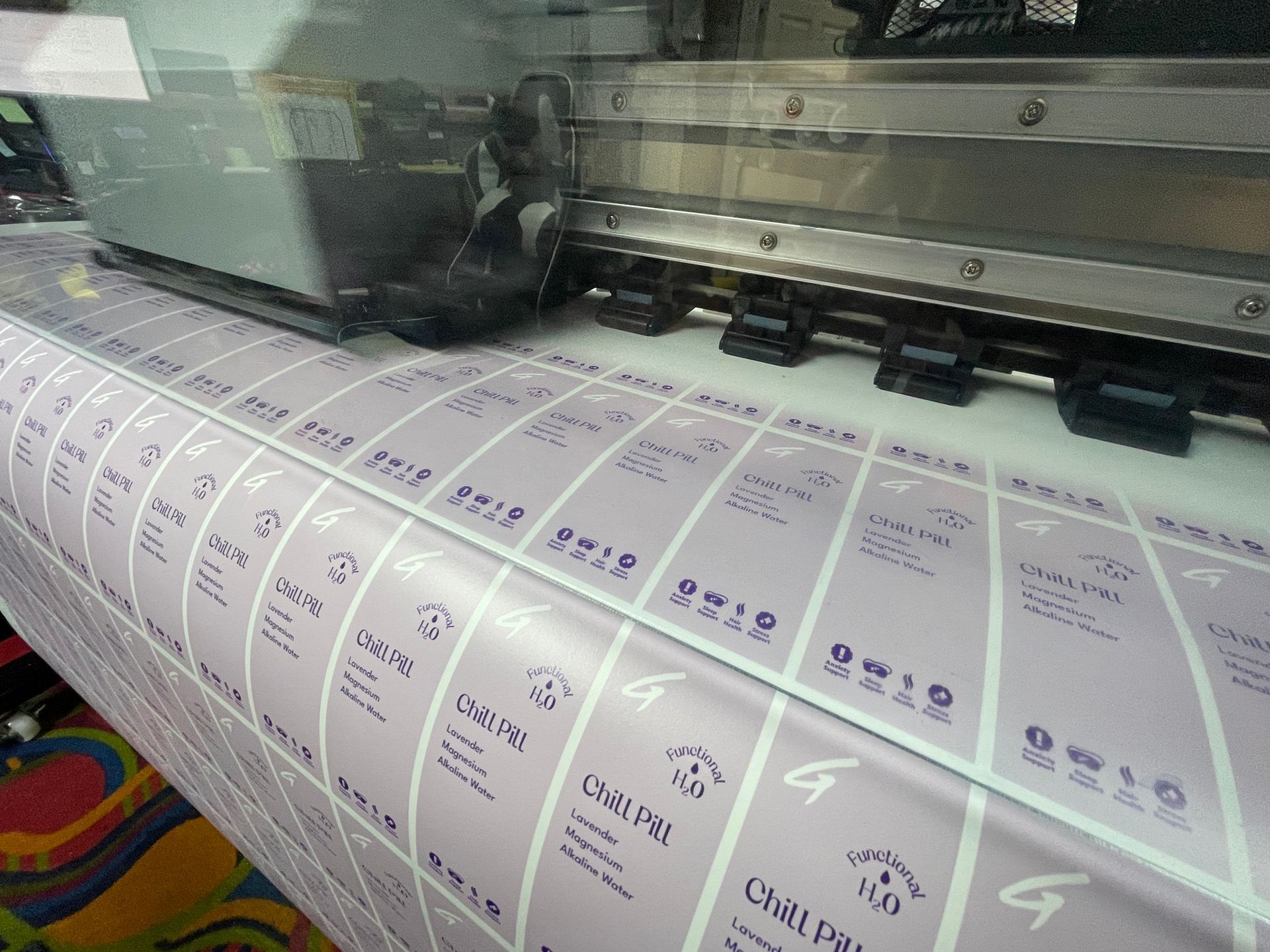 A machine is printing a large amount of purple labels