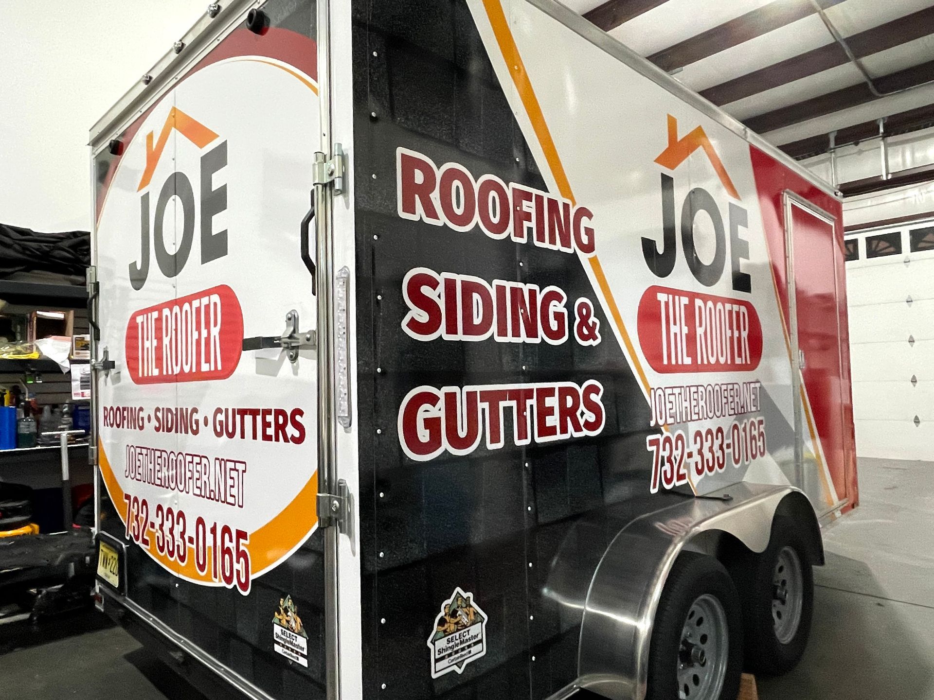 A trailer for joe roofing siding and gutters