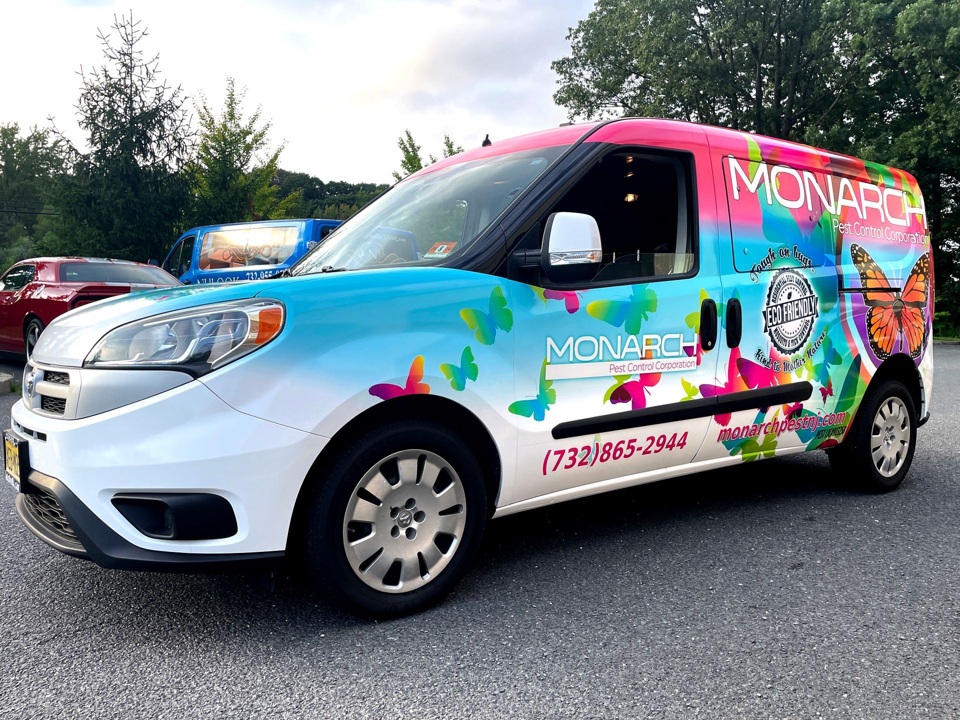 A colorful van is parked in a parking lot.