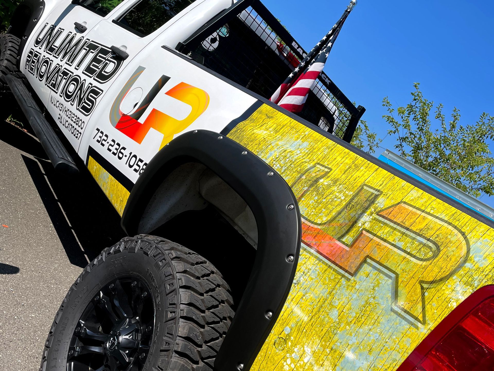 A white truck with the word unlimited on the side