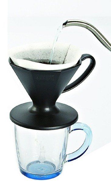 Water from a kettle pouring into a pour over coffee maker