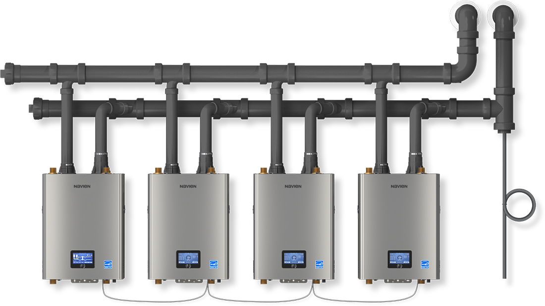 Two air conditioning units near a brick wall with electrical connections.