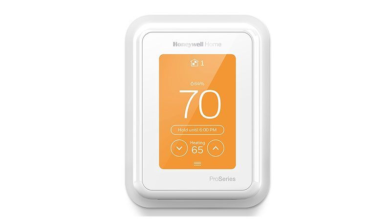 Honeywell Home thermostat displaying orange screen with 70°F and set point of 65°F.