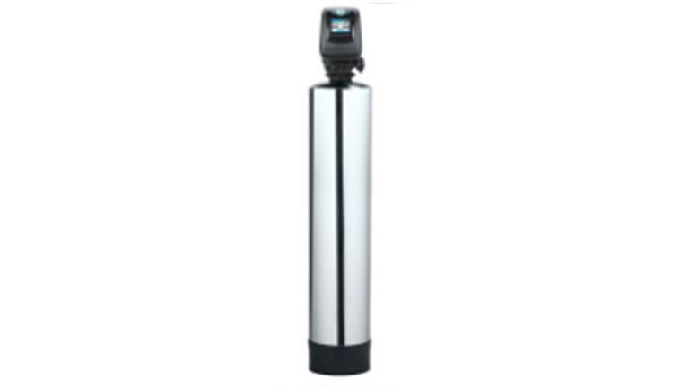 A tall, cylindrical water softener with a digital control panel on top. It is silver with a black base.
